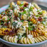 Colorful Mexican-inspired pasta with charred corn, red bell pepper, and tangy Cotija cheese crumbles.