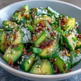 Creamy smashed cucumber and avocado salad, glistening with sesame-ginger dressing.