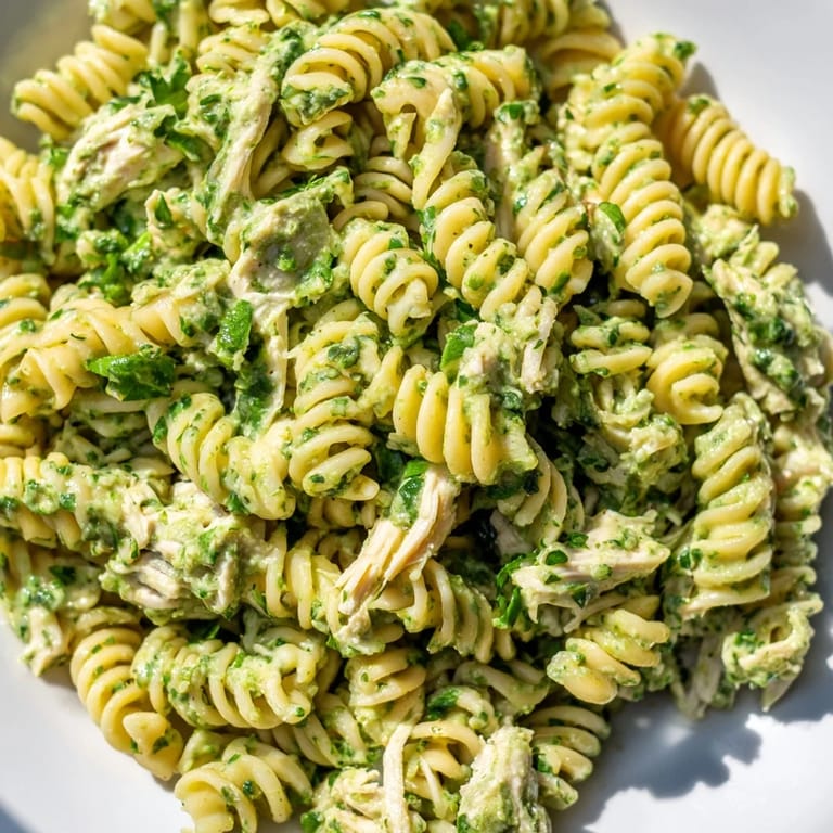 Close-up of creamy Cilantro Lime Chicken Pasta with shredded chicken and bright herbs, perfect for a fresh and easy weeknight dinner.