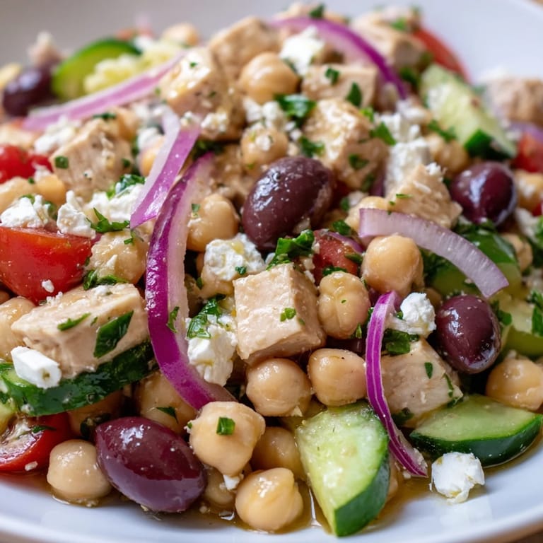 Tasty Mediterranean Chickpea Chicken Salad served on a plate, ready for lunch, featuring tender chickpeas and diced vegetables coated in dressing.